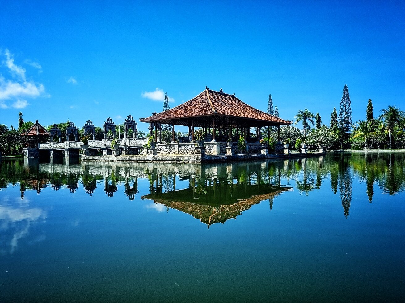 Breathtaking panoramic view of Taman Ujung Water Palace with Mount Agung volcano in the distance
