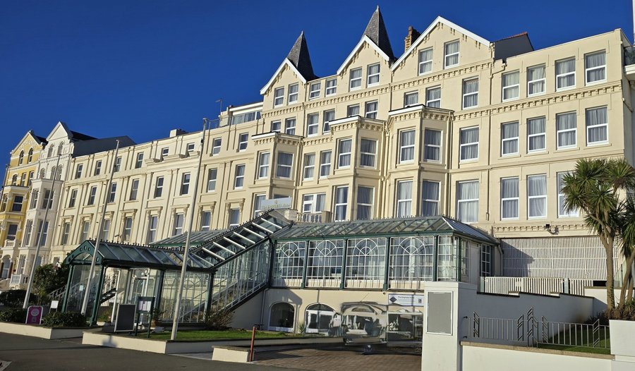 Exterior after new windows and painting in January 2025