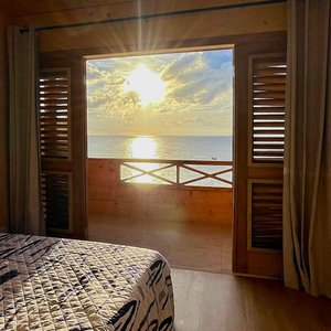 The Senior Suite on the upper level features a separate bedroom with Queen-sized bed, stunning ocean views, and its own private balcony. Wake up to the sound of the waves and soak in the perfect combination of eco-friendliness, comfort and breathtaking scenery.