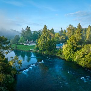 Long regarded as one of the world’s most revered and inspirational luxury accommodations, Huka Lodge is set among 17-acres of established, parklike gardens along the banks of the emerald-blue Waikato River near Lake Taupō on New Zealand’s North Island.