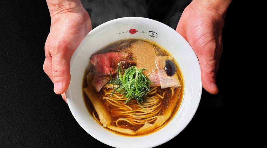 Shoyu Soba This ramen is a testament to the harmonious marriage of Japanese and Western culinary influences, expertly curated within a single bowl. Each element in this dish embodies the fusion of diverse cuisines: the four seasons of Japanese culinary tradition, the delicate textures of Chinese cuisine, the flavorful accents of Italian cooking, and the layered complexity of French gastronomy. 