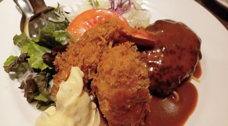 Three-item lunch set including rice, hamburger steak with soup, fried shrimp, and cream crab croquette