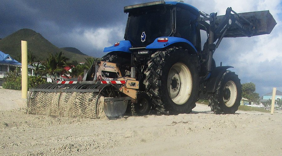 Tractor Removing Seaweed from Orient Beach on St. Martin
