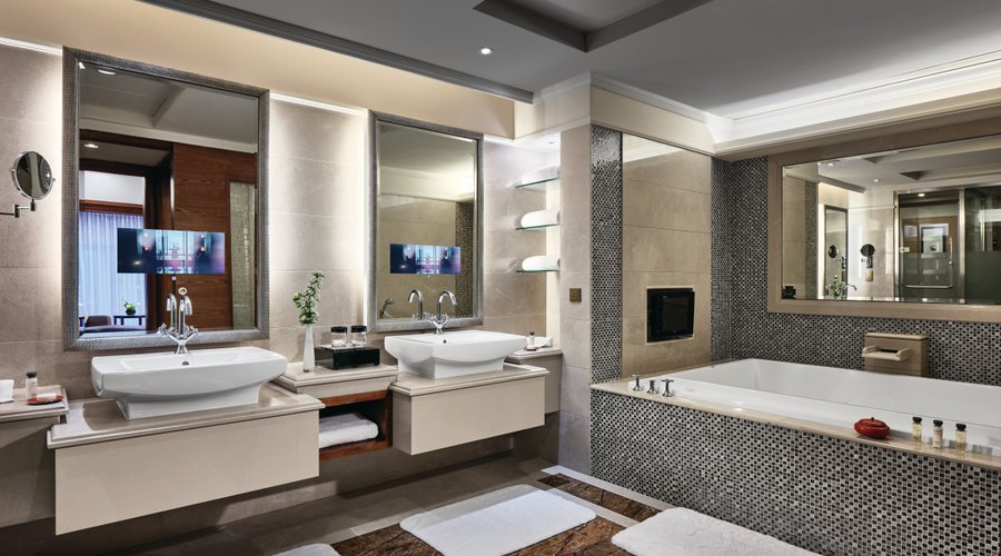 Spacious bathroom with twin washtable and double-ended bathtub