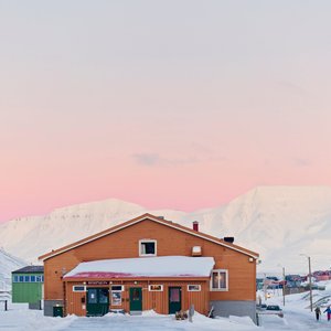 The main building of Coal Miners's Cabin in the snow. 