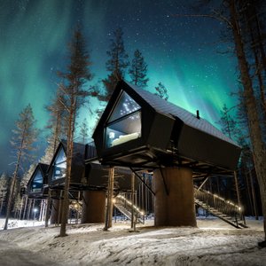 Enjoy a luxurious nature getaway in one of our Aurora Treehouses, a cosy cottage perched on a 3-metre pillar among Arctic evergreens. The panoramic window commands a magnificent view of the lake and gives you a front row seat to the spectacular winter display of Northern Lights! The fine interior combines the charm of the countryside with the modern flair of Finnish design. The pine panelling and warm king-size bed alone will give you a sense of great comfort. The only downside: you'll find it.
