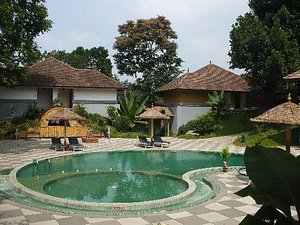 The Elephant Court in Thekkady, image may contain: Hotel, Resort, Villa, Chair