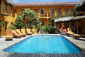 Seaside Cabanas Hotel in Caye Caulker, image may contain: Hotel, Resort, Villa, Pool