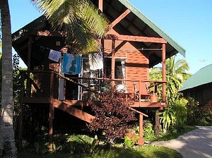 Coral Gardens in Alofi, image may contain: Villa, Shelter, Hut, Neighborhood