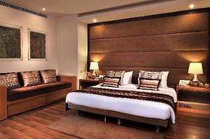 Udman Hotel by Ferns N Petals, Panchshila South Delhi in New Delhi, image may contain: Interior Design, Indoors, Wood, Home Decor