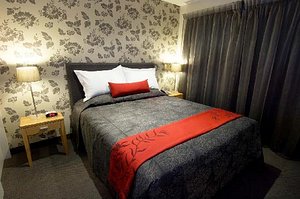 Wai Ora Lakeside Spa Resort in Rotorua, image may contain: Furniture, Bed, Bedroom, Room