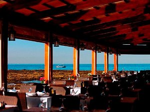 Byblos Sur Mer in Byblos, image may contain: Restaurant, Indoors, Waterfront, Dining Table