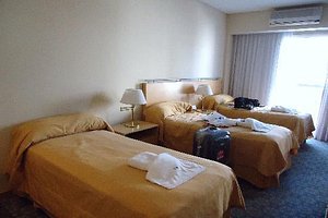 Intersur Suites in Buenos Aires, image may contain: Furniture, Dorm Room, Bed, Handbag