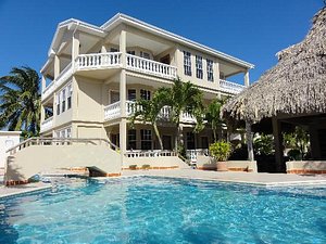 Iguana Reef Inn in Caye Caulker, image may contain: Villa, Housing, Hotel, Resort