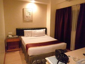 Silam Dynasty Hotel in Lahad Datu, image may contain: Handbag, Furniture, Bed, Bedroom