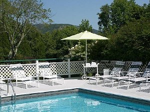 Cedar Crest Inn in Camden, image may contain: Pool, Water, Chair, Resort