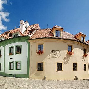 Hotel Zlaty Andel in Cesky Krumlov, image may contain: Home Decor, Living Room, Furniture, Chandelier