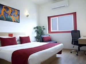 Red Fox Hotel, East Delhi in New Delhi, image may contain: Dorm Room, Indoors, Furniture, Bed