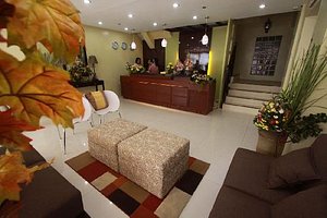 Sampaguita Suites-Plaza Garcia in Cebu Island, image may contain: Foyer, Indoors, Home Decor, Furniture