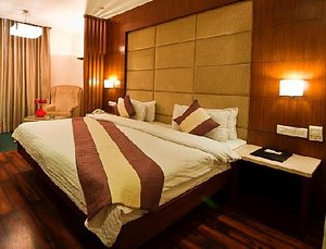 Hotel Aura in New Delhi, image may contain: Interior Design, Resort, Hotel, Bed