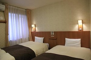 Dormy Inn Toyama in Toyama, image may contain: Dorm Room, Furniture, Bedroom, Hotel