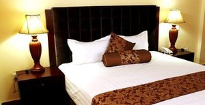 Silver Palm Hotel in Arusha, image may contain: Table Lamp, Lamp, Cushion, Home Decor