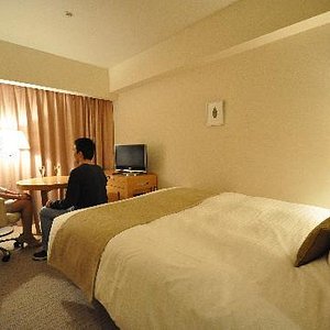 Richmond Hotel Fukushimaekimae in Fukushima, image may contain: Furniture, Bedroom, Person, Dorm Room