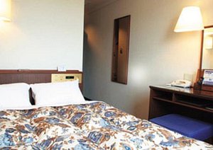 Arc Inn Kurosaki in Kitakyushu, image may contain: Dorm Room, Furniture, Lamp, Table Lamp