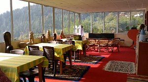 Shepherd's Lodge Devi Darshan in Auli, image may contain: Restaurant, Dining Table, Table, Resort
