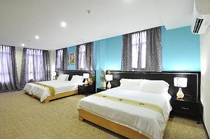 Hallmark View Hotel in Melaka, image may contain: Furniture, Home Decor, Bed, Bedroom