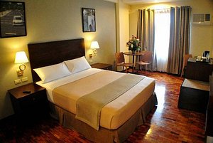 Fersal Hotel - Kalayaan in Luzon, image may contain: Bed, Furniture, Bedroom, Indoors