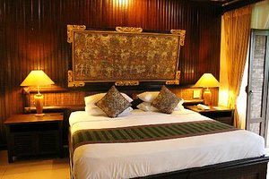 Hotel Tjampuhan & Spa in Ubud, image may contain: Cushion, Home Decor, Lamp, Table Lamp